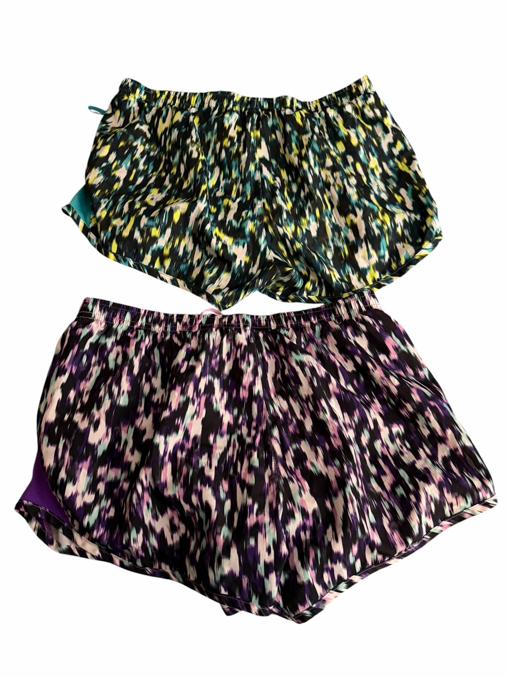 Two pair of Nike Tempo running shorts, size medium. Bright colors lightweight